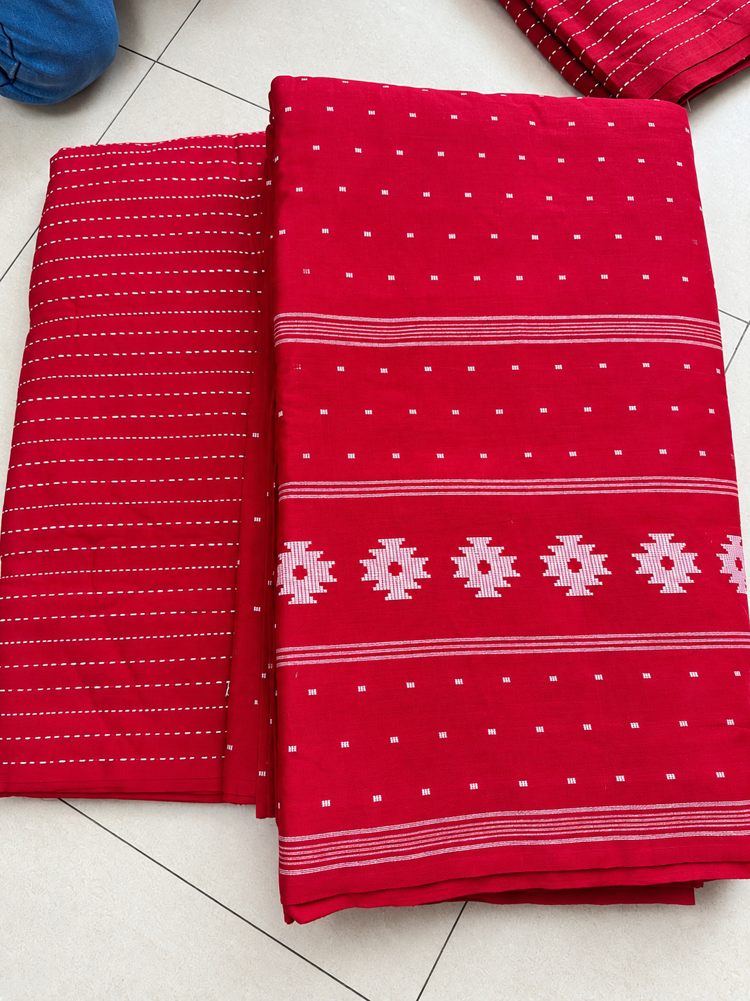 Red fabric with traditional white motifs